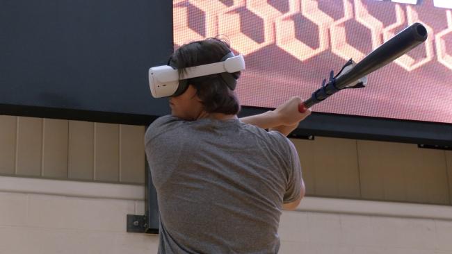 Waynesburg University student athlete uses VR headset for batting practice