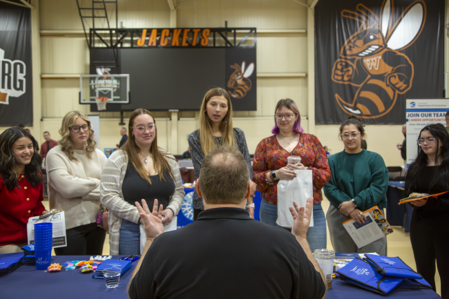 Students meet with recruiters at the CJ Fair on campus