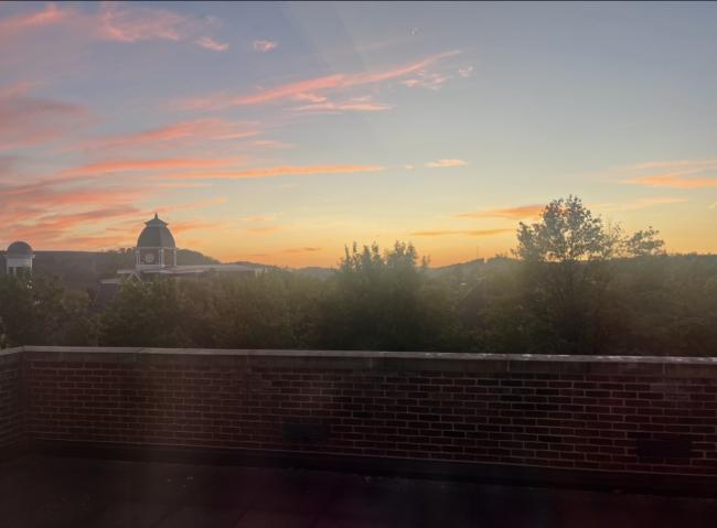 A sunset pictured behind the Stover Center