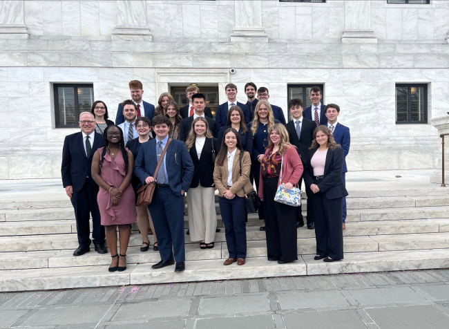 Current and past Stover Scholars pictured with Dr. Stratton outside the Supreme Court building