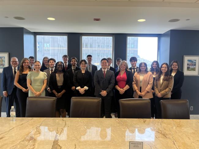 Ryan McCann ('22) pictured with the Stover Scholars and Dr. Stratton