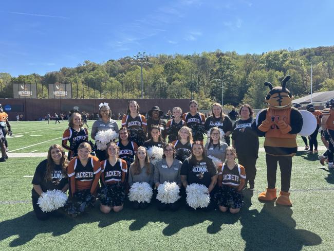 The cheerleading alumni pose for a picture during Homecoming 2025.