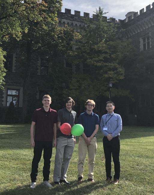 Chen pictured at the conference with the Waynesburg University programming team