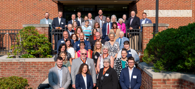 Attendees of the President’s Partner Recognition Breakfast pictured on the cement steps outisde Benedum Dining Hall on the University's campus